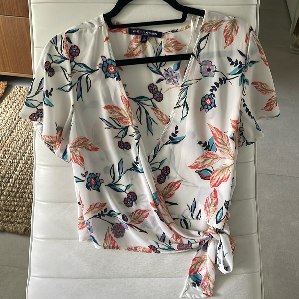 Women size small white Flower top open v neck sheer material wrap to side strap